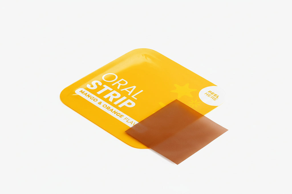 Yellow packaging of an oral strip with a brown strip inside on a white background.