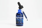 Bottle of Methylene Blue Drops with dropper on a white background