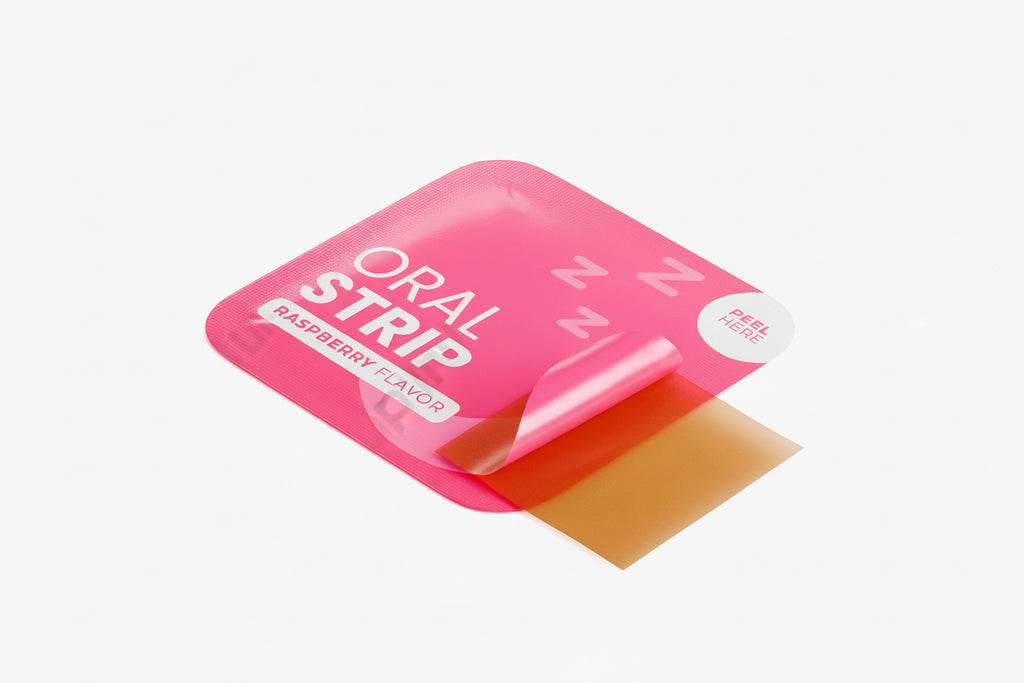 Pink packaging of an 'Oral Strip' with a red strip inside on a white background.