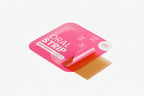 Pink packaging of an 'Oral Strip' with a red strip inside on a white background.