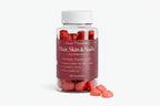 Bottle of Hair, Skin & Nails Gummies with red gummy bears on a white background